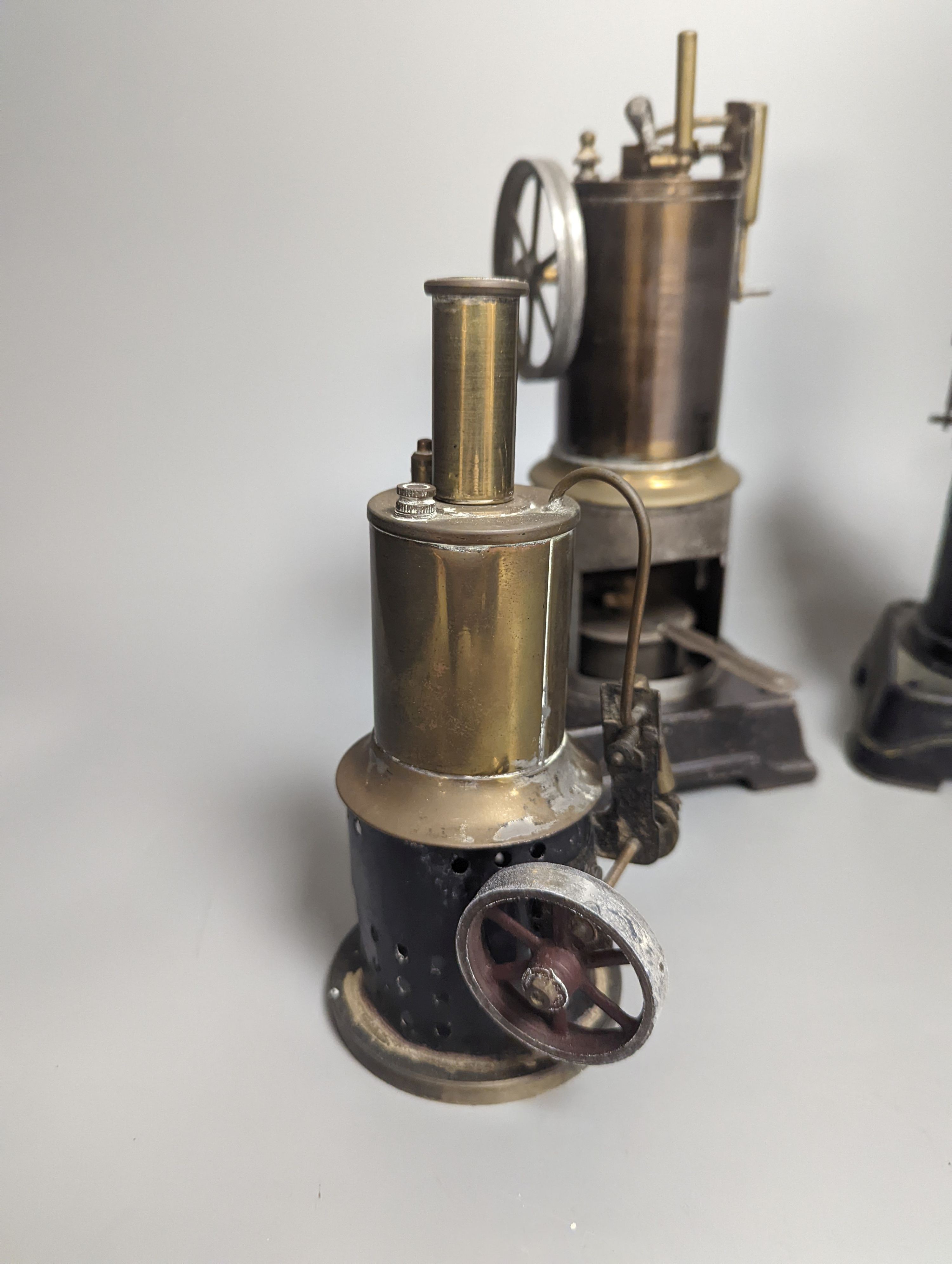 A Bing tinplate model boiler, 28.5 cm high and two other tinplate model boilers